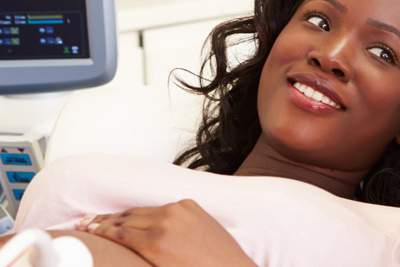 A pregnant woman undergoing an ultrasound.